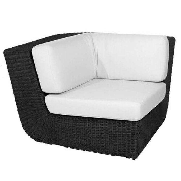 an outdoor chair with white cushions and black wicker frame, on a white background