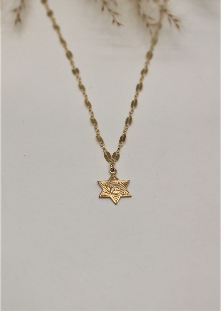 "This effortless classic look is great to wear everyday and the absolute perfect gift for Jewish holyday Bat mitzva .... Its dainty, meaningful and chic! This necklace is extremely light to achieve the dainty look and this necklace is great when its a bit shorter Perfect for layering necklaces L E T S . T A L K . N E C K L A C E S ✤ Available in 14k Gold Filled or Sterling Silver ✤ Star of David measures about 13mm ✤ Model is wearing size - 14\" ✤ Available sizes * Please choose in drop down box Classic Star Of David Necklace As Gift, Classic Star Shaped Necklace For Gift, Dainty Star Of David Charm Necklace For Gift, Classic Star Of David Necklace For Gift, Classic Star-shaped Necklace As Gift, Classic Star Of David Jewelry For Gift, Yellow Gold Star Of David Necklace With Delicate Chain, Classic Star-shaped Necklace For Gift, Star Of David Gold Necklace