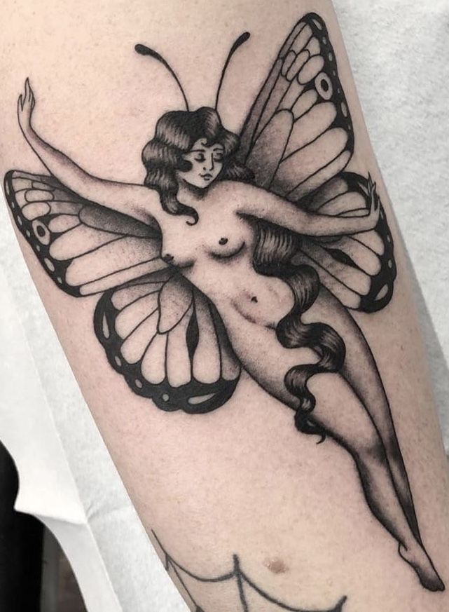 a woman with a butterfly tattoo on her arm