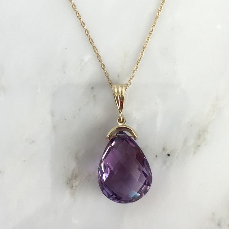 Details: Lovely vintage amethyst pendant and 14K gold necklace. The amethyst is faceted, and has an amazing sparkle glow. The amethyst measures 15.19 x 19.67 x 10.37mm, and is roughly 14.5 carats. This pendant is sold with a 14K gold chain, and the chain is modern. Please ask all necessary questions prior to placing an order! Size: The chain measures 16 inches, and the pendant is 1 1/4 inches. Condition: The overall all condition of this piece is very good. Teardrop Amethyst Necklace For Formal Occasions, Purple Teardrop Pendant Necklace For Formal Occasions, Purple Drop Necklace For Formal Occasions, Purple Teardrop Necklace For Formal Occasions, Formal Teardrop Amethyst Necklace, Purple Teardrop Necklace For Formal Events, Formal Purple Drop Necklace, 14k Gold Oval Necklace In Purple, Fine Jewelry Purple Teardrop Pendant Necklace