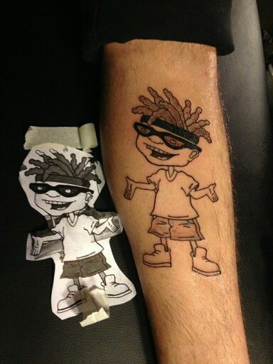 a person with a tattoo on his leg and another drawing behind him that has been placed in front of them