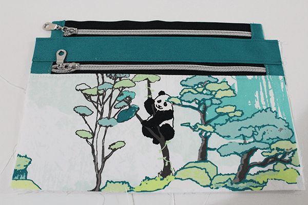 a small purse with a panda bear on it