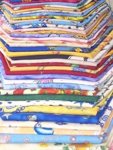 a stack of folded shirts sitting next to each other