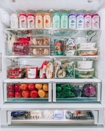 an open refrigerator filled with lots of food and condiments on the shelves next to each other