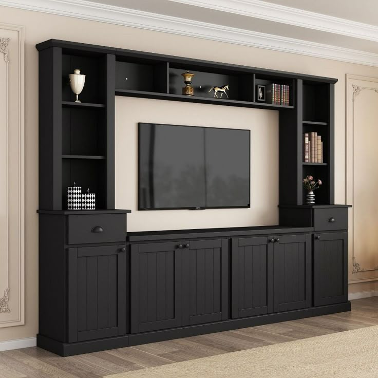 a black entertainment center with built in bookshelves