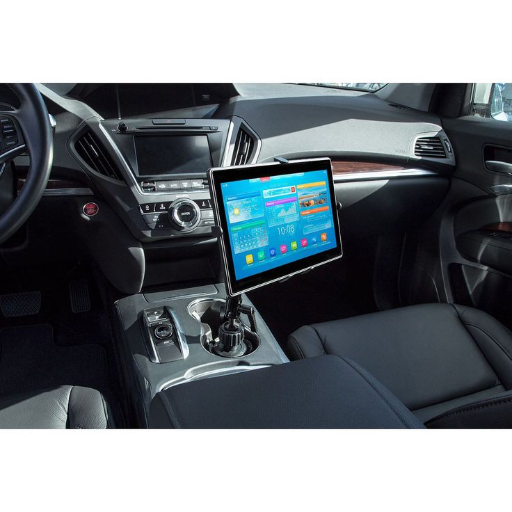 a car dashboard with a laptop on it