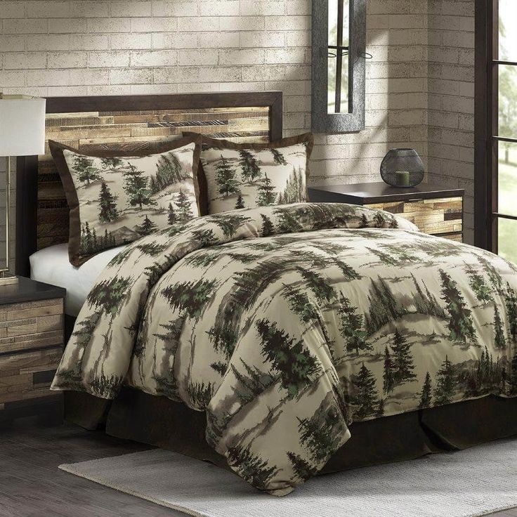 the comforter is made up with pine trees on it