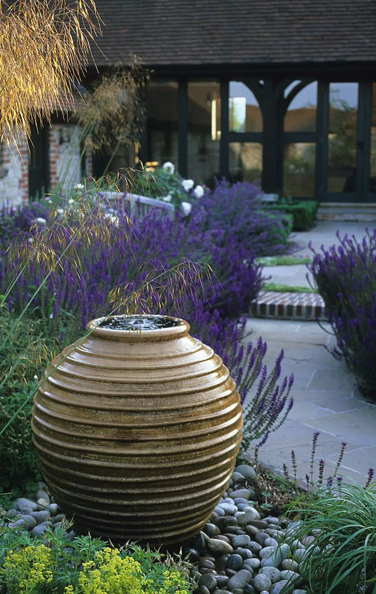 a garden filled with lots of purple flowers