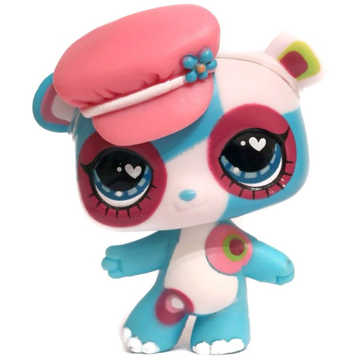 the littlest pet shop doll is wearing a pink hat