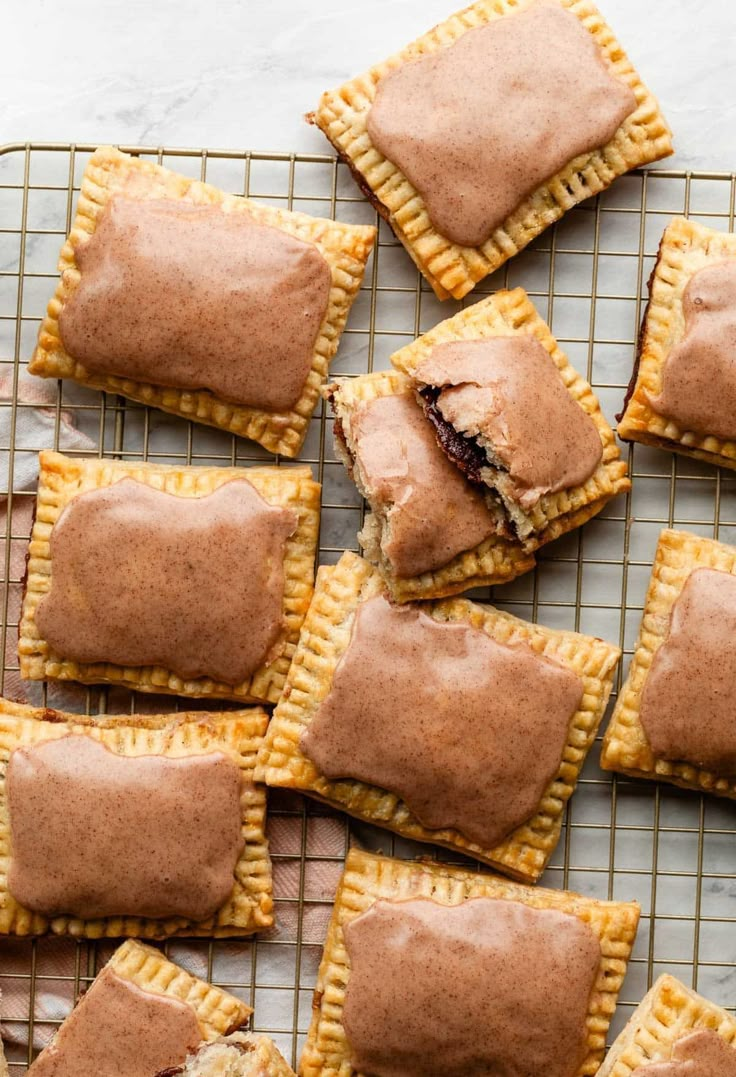 several small pastries on a cooling rack