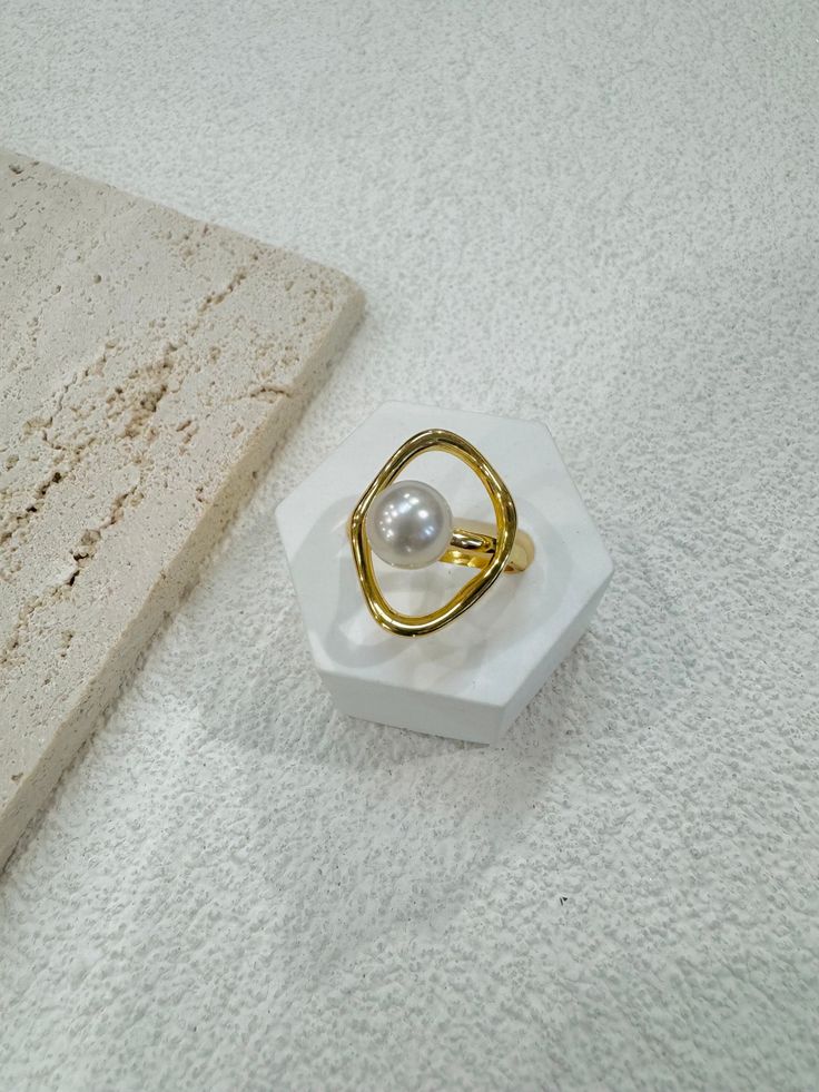 Welcome to PearlologyBoutique! Super High iridescent luster near round shape white south sea pearl in the size about 8mm rested on a minimalist design 14k gold vermeil textured band with. It is very rare to see this small size south sea pearl,especially with such beautiful luster. You won't be disappointed when you see the luster of this pearl. 💛Pearl Type: White South Sea Pearl 💛Pearl Size: Approx 8mm 💛Color: White, cream 💛Shape: Near round 💛Surface: see video and pictures  💛Band: 14k gol Gold Pearl Charm Open Ring, Gold Pearl Ring With Charm For Gift, Gold Round Pearl Charm Ring, South Sea Pearl Ring, Saltwater Pearls, Sterling Silver Rings Bands, Gift For Sister, Sea Pearl, Pearl Types