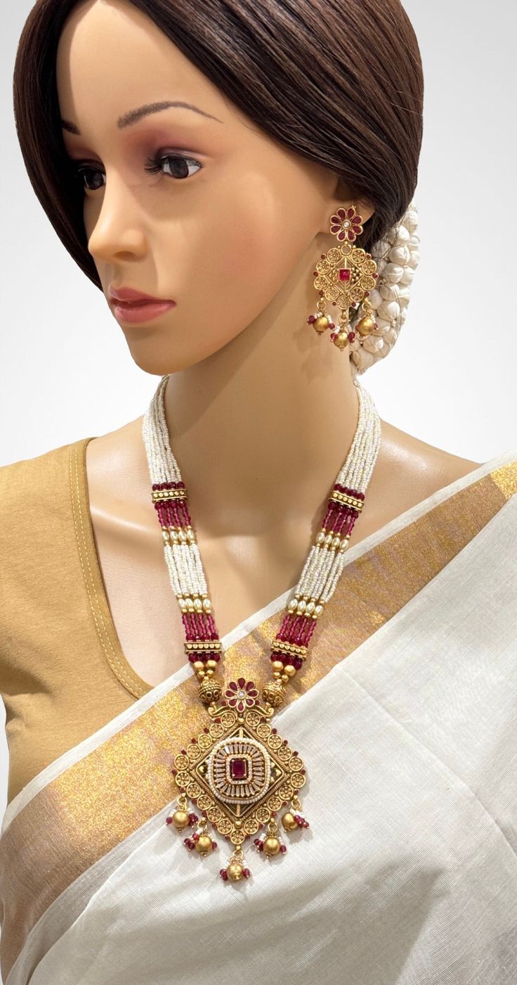 Ruby Long gold Polki mala Necklace/Rajwadi Long Necklace/South Indian Necklace/Temple jewelry/Indian Wedding/Rani Haar/Pakistani Jewelry Antique Mala Pendant Set With Gold Plating Adjustable Length  This is 100% Handmade jewelry. So Color, shades, texture displayed may slightly vary from the actual product due to digital image limitations. We request you to consider these minor variations. Please expect the possibility of some slight imperfections when buying handmade jewelry. If you have any qu Pearl Kundan Necklace For Gift In Temple Jewelry Style, Temple Style Kundan Necklace With Pearls For Gifts, Temple Style Pearl Jewelry For Puja, Kundan Pearl Chain Necklace For Gift, Kundan Temple Jewelry Necklace With Pearl Chain, Temple Style Kundan Necklace With Pearl Chain, Temple Necklace With Pearl Chain As Diwali Gift, Gold Chandbali Pearl Necklace For Puja, Pearl Chain Necklace For Celebrations And Festivals