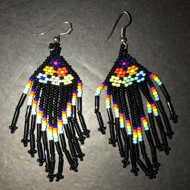 These Beautiful Earrings From Artisan Mxico Are A True Work Of Art. The Colorful Beads And Delicate Fringe Create A Boho Folk Style That Will Make Any Outfit Pop. Handmade In Mexico, These Earrings Showcase The Country's Rich Cultural Heritage. The Earrings Feature A Mix Of Black And Multicolored Beads, Adding A Playful Touch To Any Outfit. The Dangling Fringe Adds Movement And Texture, Making Them Perfect For A Night Out Or A Casual Day. Please See Photographs For A Better Understanding Of The Black Dangling Beads Jewelry For Beach, Beach Jewelry With Black Dangling Beads, Black Beach Jewelry With Dangling Beads, Yellow Festival Beaded Earrings, Yellow Beaded Earrings With Ear Wire For Festivals, Black Beaded Earrings With Dangling Beads For Beach, Artisan Black Jewelry For The Beach, Adjustable Yellow Artisan Beaded Earrings, Black Round Beads Earrings For Festival