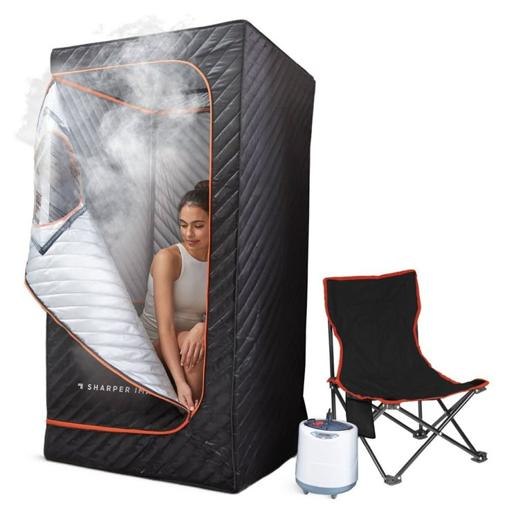 a woman sitting in a portable steam saunage