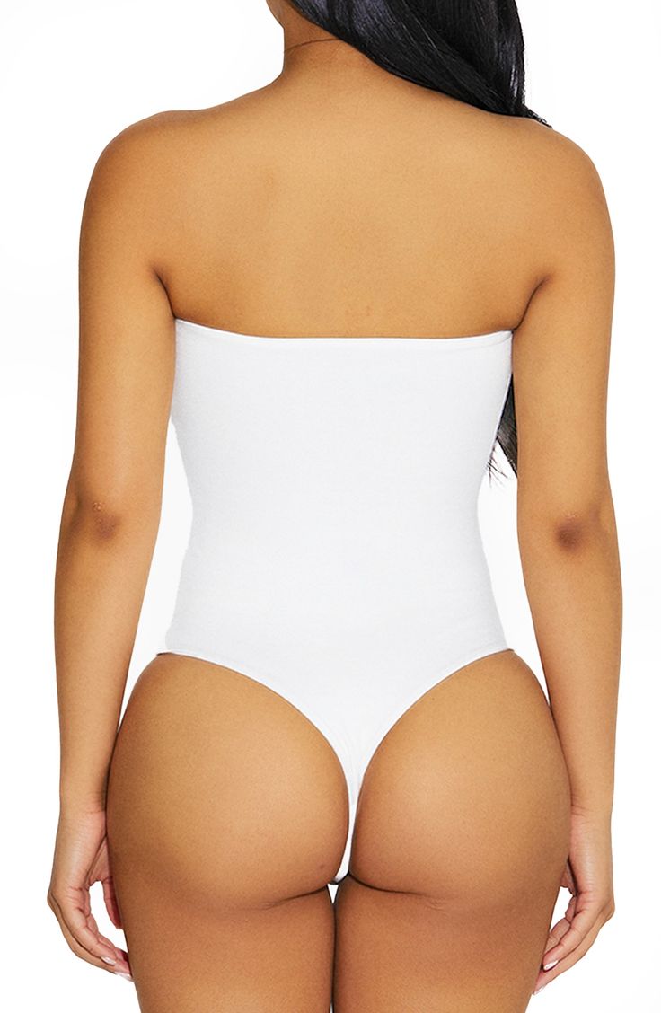 With comfy compression and a crepe-like finish, this curve-hugging bodysuit in a strapless silhouette is a versatile addition to your going-out wardrobe. Strapless 95% viscose, 5% spandex Hand wash, line dry Imported Strapless Shaping Bodysuit With Built-in Bra, Strapless Smoothing Bodysuit Shapewear, Strapless Smoothing Shapewear Bodysuit, Strapless Shaping Bodysuit Shapewear, Strapless Shaping Bodysuit, Strapless Shapewear Bodysuit With Lined Body, Strapless Shapewear Bodysuit With Built-in Bra, Elegant Strapless Smoothing Bodysuit, Solid Strapless Smoothing Bodysuit