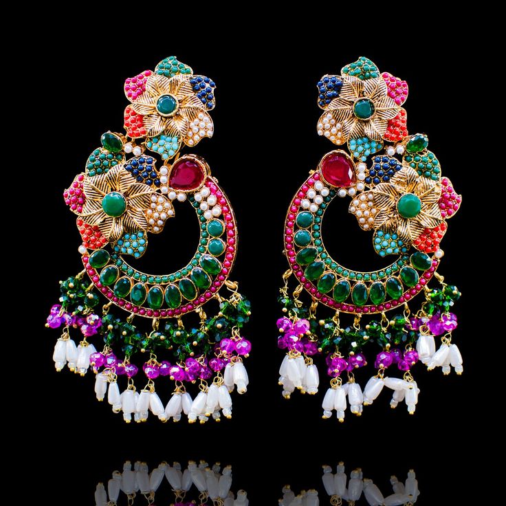 Bejewel an incandescent style and ethereal charm with our Raha Earrings! Unveil the beauty of nauratan stones with pink and emerald colored beads and the sophistication of moti details. Approximate earrings length is. Gold-plated on high-quality brass as base metal. Made by order. Kindly allow 5-7 weeks for the delivery of this item. For custom or urgent requests, please contact support@alacouture.com. *Please Note: We use faux stones and beads in all of our jewelry.