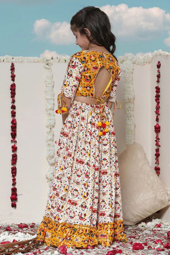 VASTRAMAY Girls' Yellow & Cream Patola Print Lehenga Set Dress your girl up in style with this adorable lehenga set featuring a beautiful Patola print crop top and a matching skirt. Crafted from rayon for comfortable wear, this set is perfect for special occasions and festive celebrations. Key Features Yellow and cream Patola print Crop top with round neck and half sleeves Rayon material for comfort Specifications Sleeve Length: Short Material & Care Material: Rayon Care Instructions: Refer to g Yellow Cotton Lehenga With Pallu, White Patola Lehenga, Luxury Yellow Bandhani Print Lehenga, Yellow Floral Print Lehenga For Navratri, Floral Print Yellow Lehenga, Yellow Cream, Sleeveless Jacket, Print Crop Tops, Girls Wear