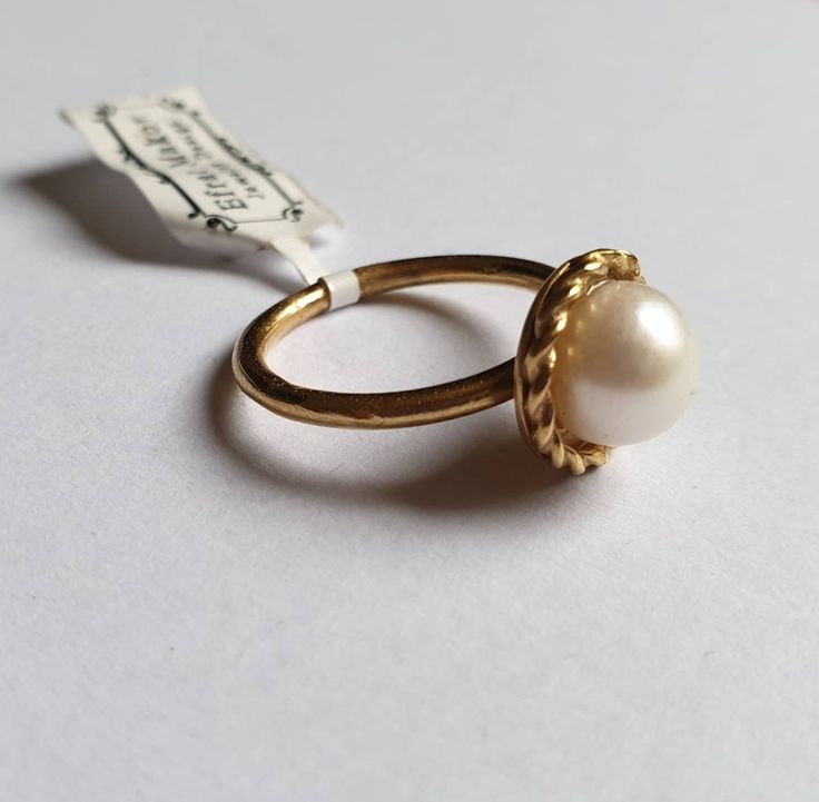 Pearl ring, Freshwater pearl ring, gold pearl ring, cocktail ring vintage, pearl solitaire ring, June Birthday ring This beautiful vintage inspired pearl ring was designed with a white, freshwater pearl creating a delicate solitaire pearl ring. The pearl is set on a golden disc which is attached to a delicate band. This beautiful cocktail ring is available both in nickel free, 14k gold plating and sterling silver. It is also available in solid 9k and 14k gold. Dimensions: The round disc diameter 14k Yellow Gold Rings With Pearl Charm, Wedding Pearl Rings With Pearl Pendant, Vintage Yellow Gold Pearl Ring, Open Ring Pearl Charm For Anniversary, Yellow Gold Pearl Drop Promise Ring, Vintage Adjustable Pearl Ring For Wedding, Classic Adjustable Gold Pearl Ring, Yellow Gold Open Ring With Pearl Drop, Gold Rings With Pearl Drop For Formal Occasions