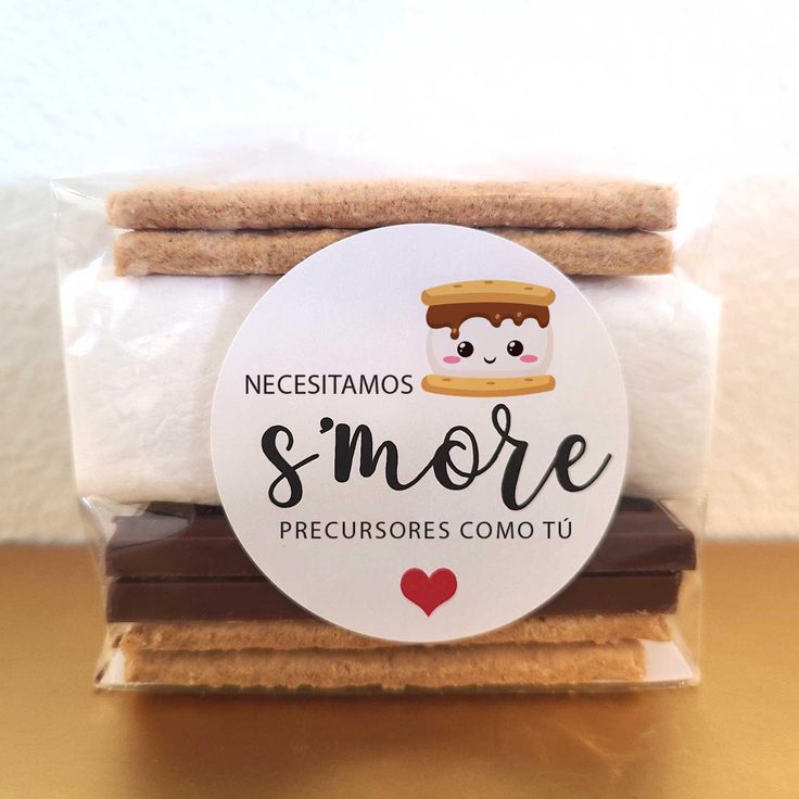 some cookies and marshmallows are stacked on top of each other with the words smore