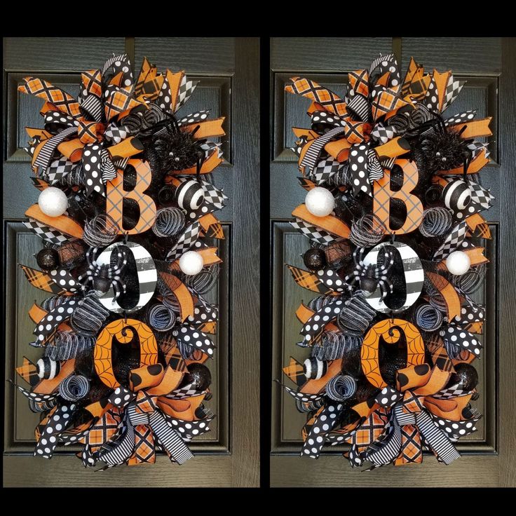 two front doors decorated with orange and black ribbons, monogrammed letters and decorations