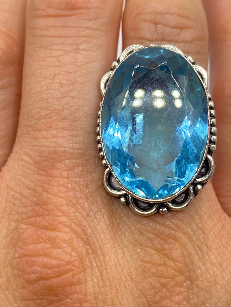 Large genuine aqua blue volcanic art glass Vintage ring Low content silver not sterling. Size 8 Our jeweler can re size this for a 20 fee.  All rings are shipped in a nice gift box.   Check out our over a THOUSAND great reviews Engraving is $4 per letter and is not always perfect depending on the piece. It can take a few days if the jeweler is busy. This is payable to Paypal Judithsltd@gmail.com Spiritual Gift Topaz Ring With Gemstone, Spiritual Style Topaz Gemstone Ring As A Gift, Spiritual Topaz Gemstone Ring As Gift, Spiritual Blue Topaz Jewelry In Blue, Spiritual Topaz Ring For Gift, Turquoise Ring With Accent Stones For Gift, Silver Crystal Ring With Large Stone As Gift, Round Turquoise Ring Perfect As A Gift, Spiritual Blue Crystal Gemstone Ring