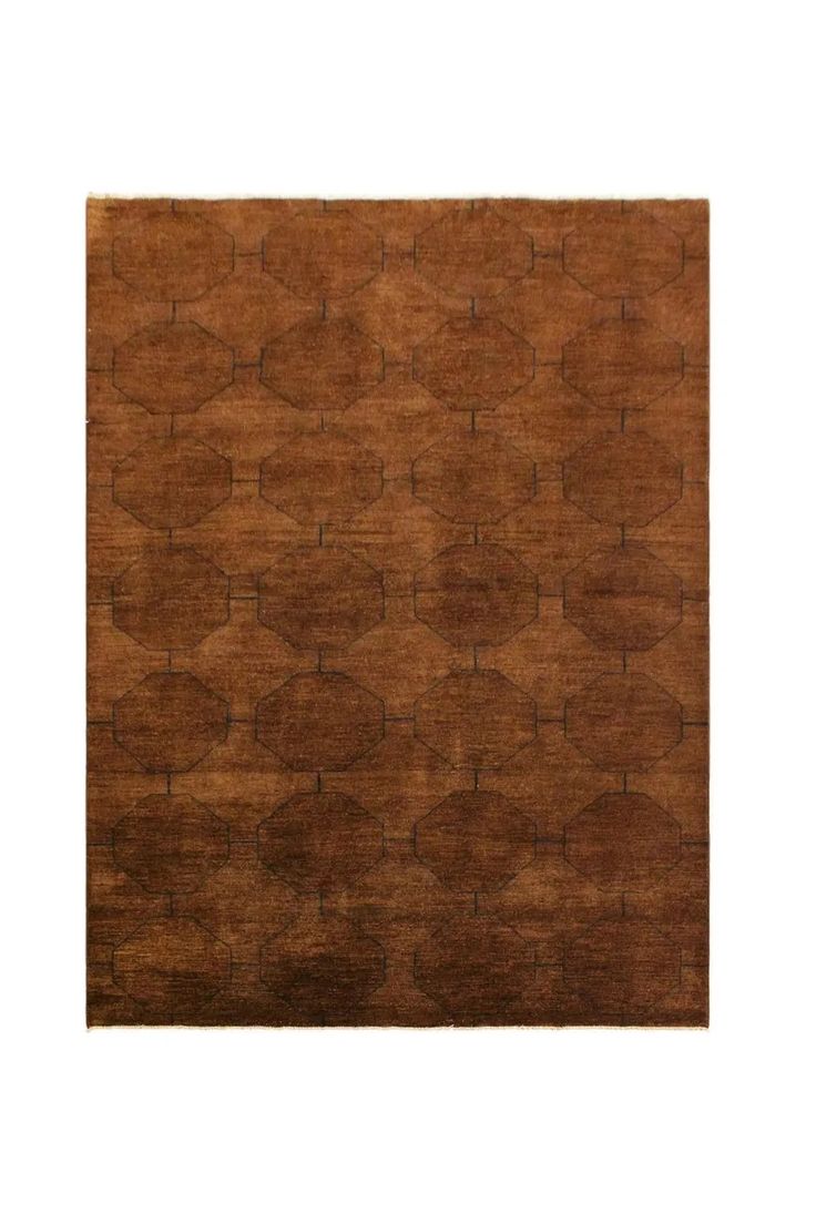 a brown area rug with circles and lines on the top, in front of a white background