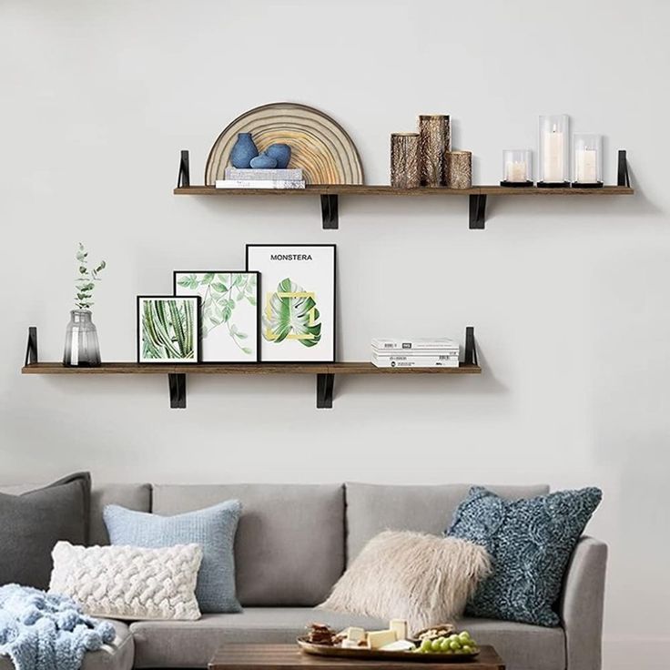 a living room filled with lots of furniture and decor on top of wooden shelving