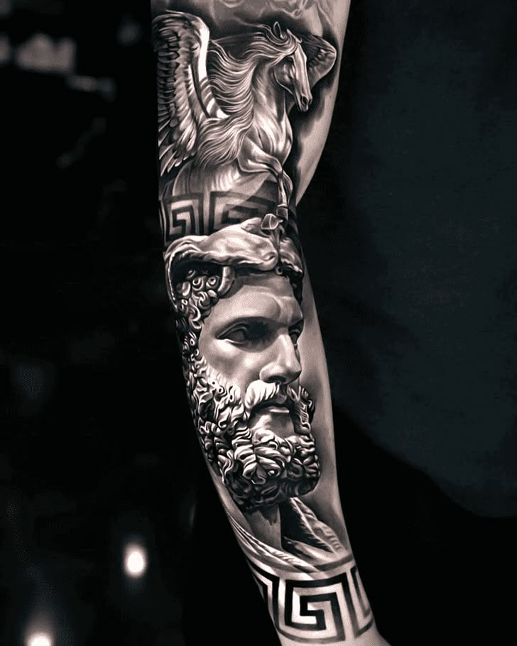 a man's arm with tattoos on it and an image of the greek god