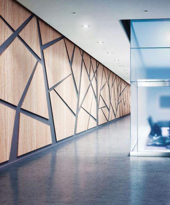 an empty room with wood paneling and glass walls