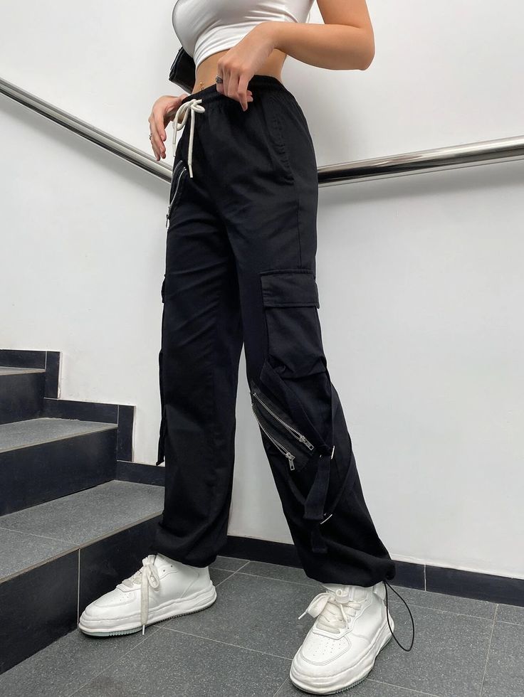 Make a fashion statement with these Zipper Detail Drawstring Cargo Pants. These pants feature a drawstring waist for a comfortable fit and zipper details that add a touch of edgy style. The combination of functionality and fashion makes them a versatile choice for various occasions. Whether you're going for a casual or street-style look, these zipper detail drawstring cargo pants will elevate your outfit. Specifications: Style: Casual Type: Cargo Pants Details: Drawstring, Pocket, Zipper Waist L Straight Leg Pants With Zipper Pocket For Streetwear, Trendy Straight Pants With Zipper Closure, Trendy Streetwear Pants With Zipper Closure, Trendy Trousers With Zipper Closure, Urban Parachute Pants With Zip Fly For Streetwear, Urban Wide Leg Bottoms With Zipper Closure, Straight Leg Bottoms With Zipper Pocket For Streetwear, Utility Pants With Zipper Closure For Fall, Casual Black Pants With Zipper Pocket