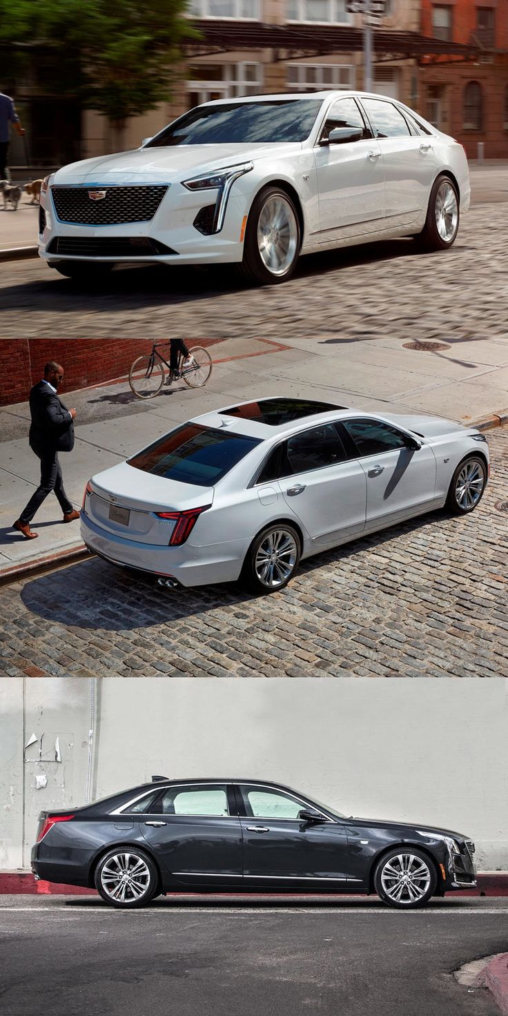 two cars side by side, one is white and the other is black with chrome rims