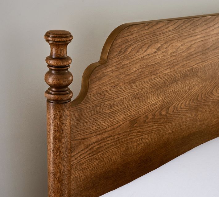 the headboard and foot board of a wooden bed