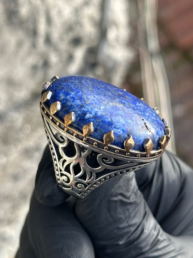 Silver Natural Lapis Lazuli Ring , Blue Large Lapis Ring , Oval Large Lapis Ring , Ottoman Style Ring , 925k Silver Ring , Gift For Him ★Item Details * Gender : Male / Female * Material : 925K Sterling Silver * Total weight :  37 Grams * Gemstone :  Lapis Lazuli Stone * Stone Size  : 30x40mm ✔ Ready to Ship in 1-2 Business Days .. ✔ Shipped to the Worldwide 1-5 business days with free shipping... ✔ The product will be sent to you with a handmade wooden box to avoid any damage during shipping... Blue Oval Cabochon Collectible Rings, Luxury Blue Oval Cabochon Ring, Luxury Blue Ring With Oval Cabochon, Hallmarked Blue Sapphire Ring With Oval Cabochon, Royal Blue Oval Gemstone Rings, Oval Gemstone Rings In Royal Blue, Oval Sterling Silver Engraved Gemstone Ring, Blue Lapis Lazuli Fine Jewelry Rings, Blue Lapis Lazuli Rings Fine Jewelry