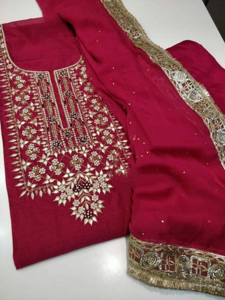 Item Overview ATHARVA Hand Embroidered Salwar Kameez/Chanderi Shirt/Reds/Gota Chiffon Dupatta/Custom Stitch Unstitch/Custom Anarkali/Plazzo/Pants Dno. CH1651 Fabric: * Shirt: Chander Silk - Embroidered Neck/ 2.5 Mts Beautiful Hand Embroidery * Dupatta: Chiffon Chinnon Dupatta 2.5Mts/ Latkans Tassels (Motifs may wary)/Exclusive Gota Patti work Border * Bottom Santoon Taffeta Silk 2.5 Mts. Excusive Hand Embroidered Party Wear Punjabi Suit. Customization: * Fabrics Customization: Designs Can be mad Traditional Red Palazzo Set For Festivals, Red Salwar Kameez With Gota Work For Eid, Red Chinon Kurta With Gota Work, Red Palazzo Set With Resham Embroidery For Celebration, Embroidered Red Palazzo Set For Party, Embroidered Red Palazzo Set For Celebration, Red Embroidered Palazzo Set For Celebration, Red Embroidered Palazzo Set For Party, Red Churidar With Gota Work For Eid