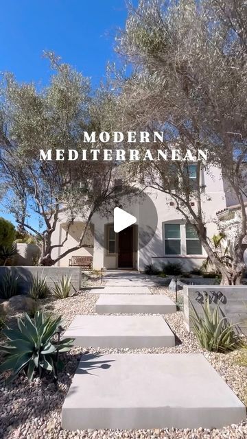 the front entrance to modern mediterranean style home