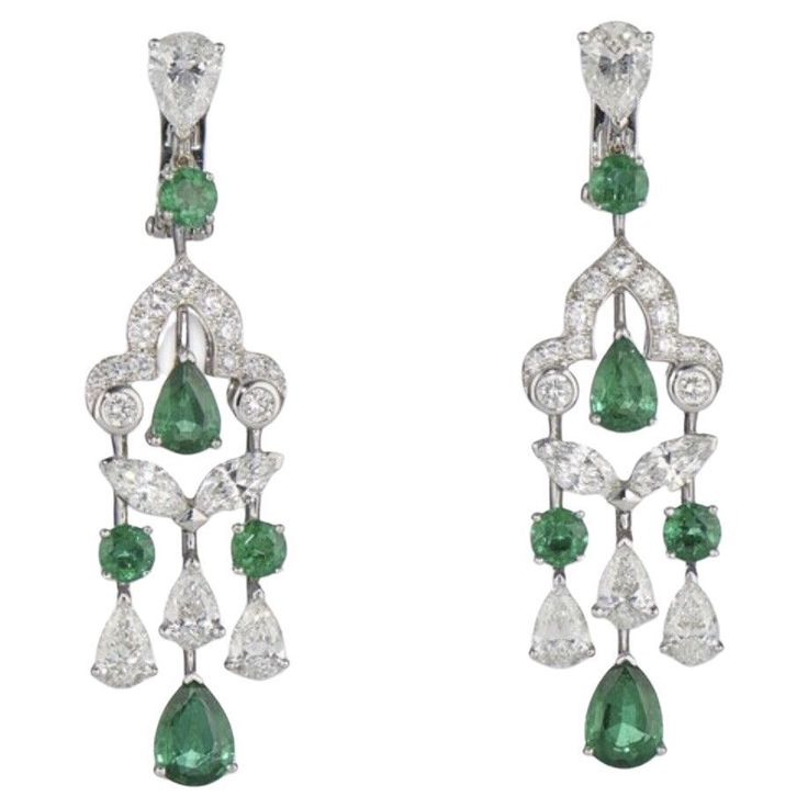 GRAFF EMERALD AND DIAMOND EARRINGS. STONES: circular-cut and pear-shaped emeralds of approximately 4.38 carats total, circular and marquise-cut and pear-shaped diamonds of approximately 6.10 carats total SIGNATURE: Graff MARKS: no. GE14932 SIZE/DIMENSIONS: 5.3 cm GROSS WEIGHT: 8.4 grams Graff Jewelry, Emerald And Diamond Earrings, Emerald Drop Earrings, Graff Diamonds, White Gold Diamond Bracelet, Emerald Earrings Drop, Diamond Chandelier Earrings, Emerald Diamond Earrings, Diamond Chandelier