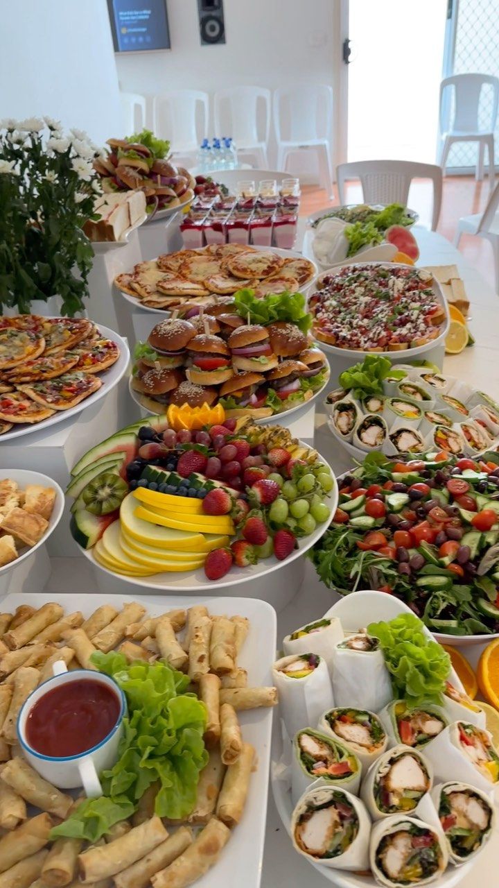 a table topped with lots of different types of foods and desserts next to each other