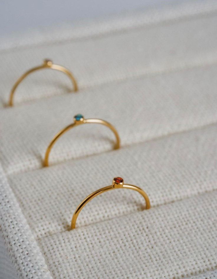 This piece makes the special perfect gift or go-to staple for yourself! ∙ D E T A I LS ∙ - 18k Gold Filled - Sizes range from 5 - 10 - 1mm Dainty Band ∙ G O L D F I L L E D ∙ 18k gold-filled components contain 100+ times more real gold than gold-plated components and are both durable and tarnish resistant. It is more affordable and accessible than solid gold but much higher quality than gold plated. ∙ H O W ∙ T O ∙ S H O P ∙ 1. Select your size 2. Select your stone 3. Add to cart! 4. Love for a lifetime Necklaces Simple, Dainty Band, Unique Pendant Necklace, Dainty Gold Rings, Gold Filled Ring, Jewelry Essentials, Stone Collection, Charm Rings, D F