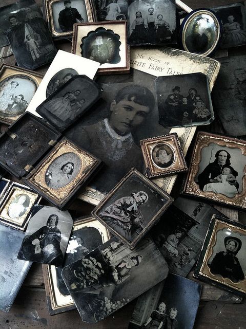 many old photographs are laying on top of each other