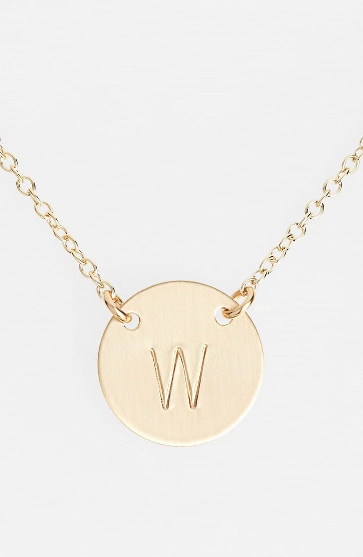 From humble beginnings to a fully staffed warehouse in Bend, Oregon, Nashelle remains true to its original purpose-handmade jewelry crafted with love and intention. The initial necklace is no different, with a hand-stamped pendant anchored by two rings for a shorter fit, making it the perfect layering piece. Style Name:Nashelle 14K-Gold Fill Anchored Initial Disc Necklace. Style Number: 1016122. Available in stores. Dainty Round Disc Yellow Gold Jewelry, Dainty Yellow Gold Round Disc Jewelry, Minimalist 14k Gold Medallion Jewelry, 14k White Gold Filled Round Jewelry, Timeless Personalized Medallion Jewelry, Classic Round Pendant Jewelry With Initials, Timeless Sterling Silver Jewelry With Initials, Dainty 14k Gold Filled Medallion Jewelry, Dainty 14k Gold-filled Medallion Jewelry