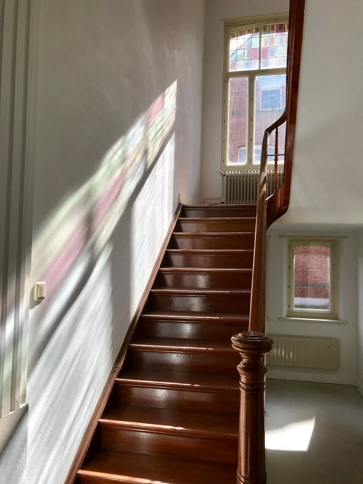 the stairs are made of wood and have no railings or handrails on them