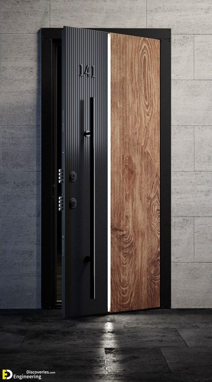 an open wooden door in front of a white brick wall with black trim and wood paneling