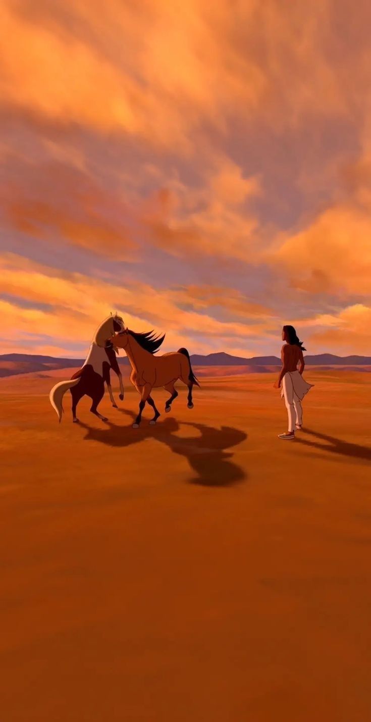 two horses are running in the desert with a woman standing next to them and an orange sky