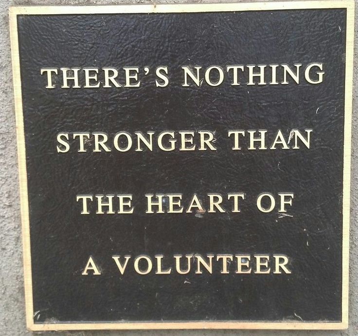 a plaque on the side of a building that says there's nothing stronger than the heart of a volunteer