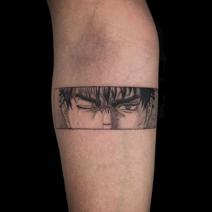 a man's leg with an anime tattoo on it