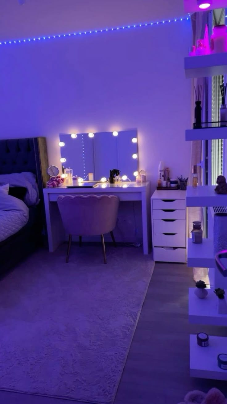 a bedroom with purple lighting and furniture in the room is lit up by lights on the wall