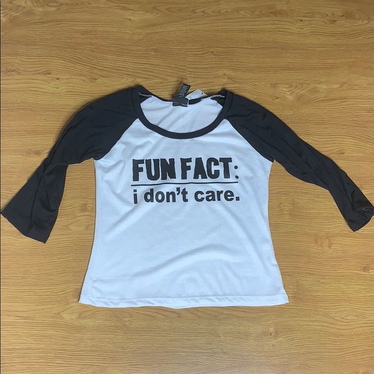 Brand New Fun Fact I Don’t Care Graphic Tee 3 Quarter Black And White Size Medium Casual Stretch Top With Funny Print, Casual Stretch Shirt With Letter Print, Black Stretch Shirt With Letter Print, Casual Stretch Shirt With Text Print, Casual Black Slogan Shirt, Black Fitted Slogan Shirt, Fitted Black Slogan Shirt, Casual Black Top With Funny Print, Fun Black Shirt With Slogan