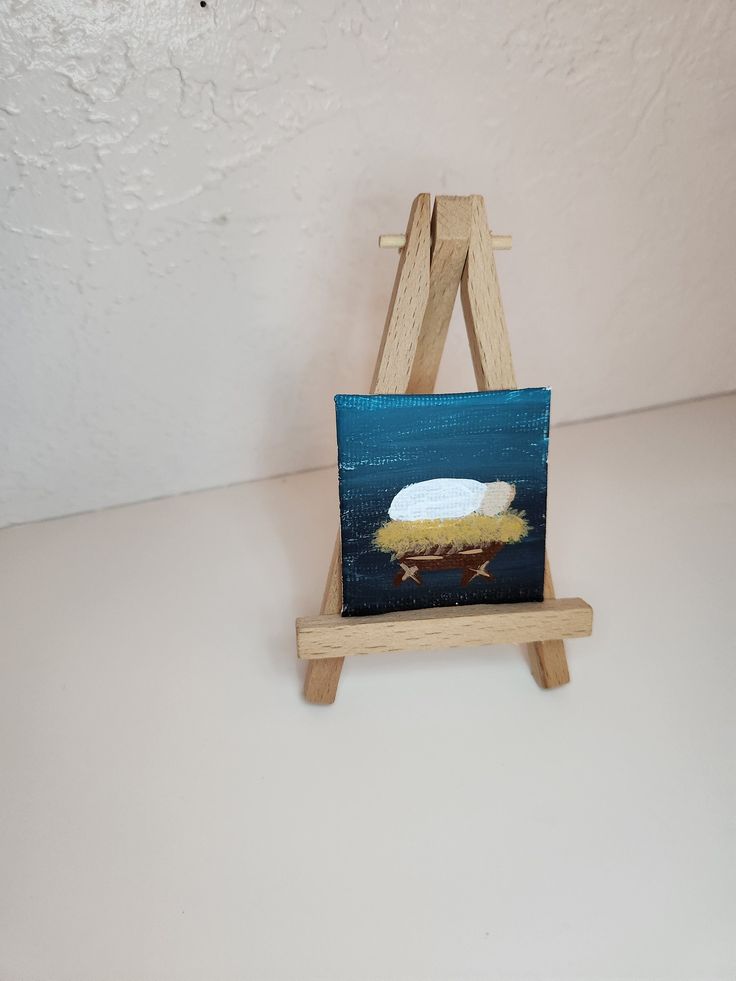 a small easel with a painting on it