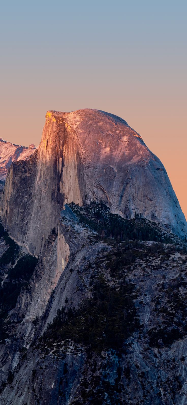 the sun is setting on half dome mountain