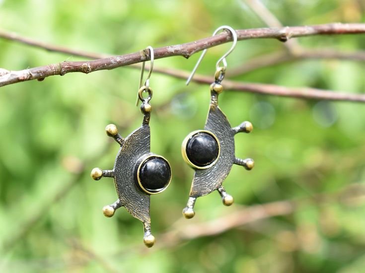 "Unique unusual earrings with gemstone. Made from bronze and decorated with black onyx. Handmade and designed by a jeweler with more than 30 years of experience in jewelry making and designing. Bronze earrings have sterling silver 925 hooks. Please note, that each gemstone is unique, therefore the color of the stone can slightly differ from the ones you see in the pictures. If you would like to order the same design earrings in sterling silver 925 or with another gemstone, please, contact us! PR Black Metal Jewelry For Anniversary, Unique Onyx Jewelry As Gift, Handmade Black Metal Jewelry, Unique Onyx Jewelry For Gift, Modern Black Earrings For Anniversary, Antique Black Jewelry For Jewelry Making, Bronze Gemstone Jewelry, Black Drop Earrings For Anniversary, Modern Black Jewelry With Matching Earrings